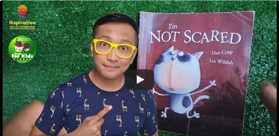 inspiration for kids teacher Emil Man pointing at a book titled "I'm Not Scared" by Dan Crisp and Lee Wildish, with a play button indicating a fabulous Flapdoodles storytime video, possibly for a