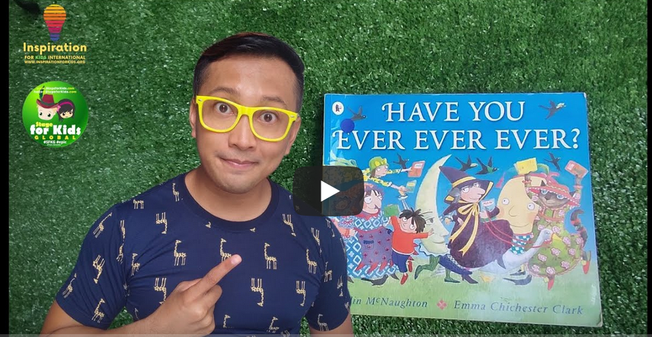 inspiration for kids teacher Emil Man with yellow glasses pointing at a children's book titled "Fabulous Flapdoodles" during a storytime video presentation.